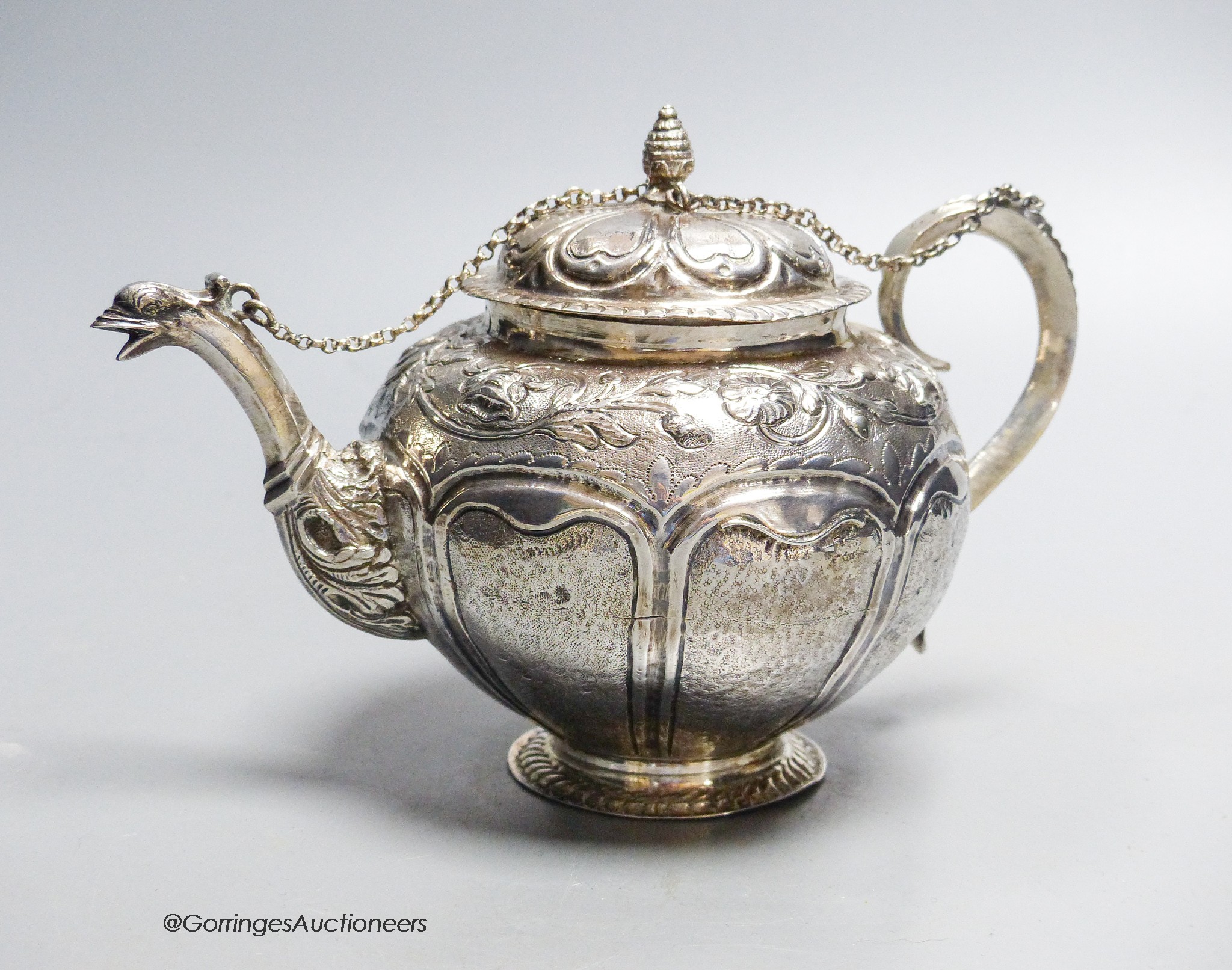 A late 18th/early 19th century Dutch? embossed white metal teapot, 13.5cm, gross 11.5oz